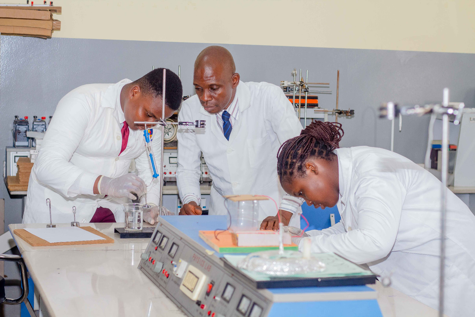Students conducting a physics experiment in the science lab